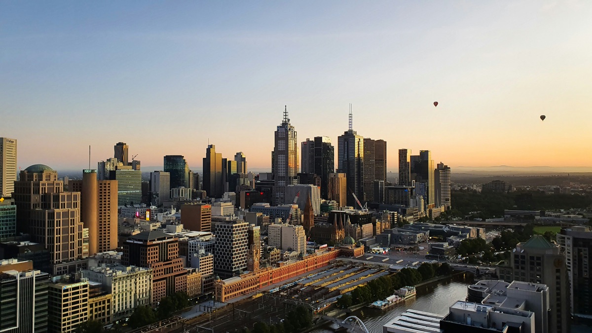 Melbourne CBD skyline at dawn over the Yarra River.